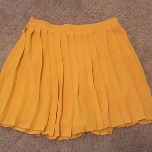 Beautiful mustard, pleated skirt